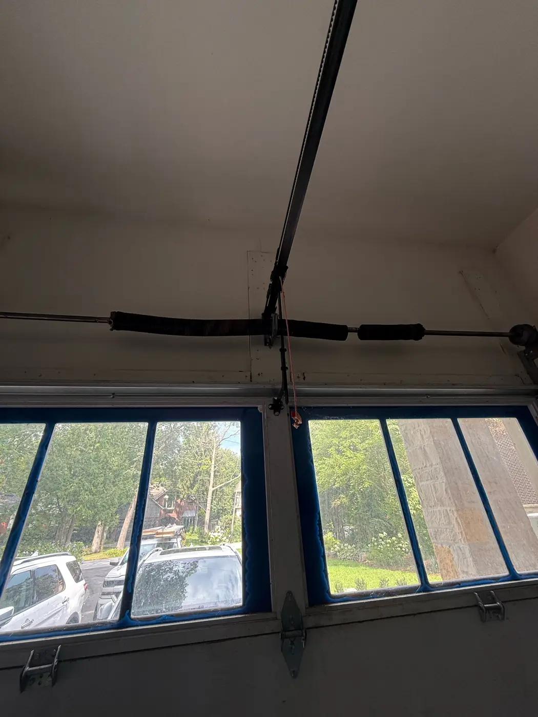 Garage door tracks, rollers and opener rail, the parts our team checks in a winter tune-up in Mississauga, Toronto and the GTA